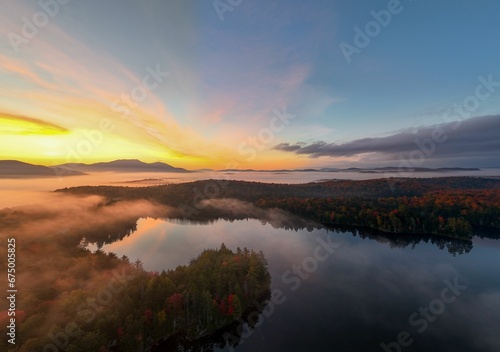 Scenic view of a sunrise over Mason Lake. © Wirestock