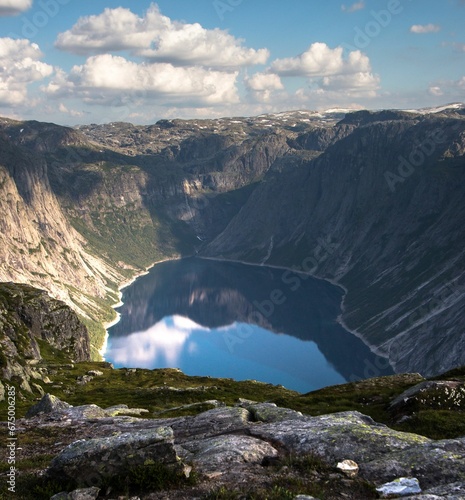 Fjord surrounded by big rocky mountains on a hike in Norway to Trolltunga