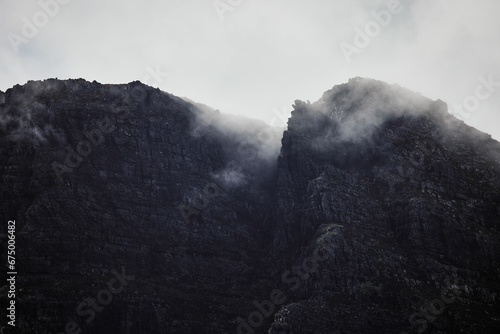 Closeup of majestic Drakenstein mountains in Wellington South Africa during a foggy weather photo