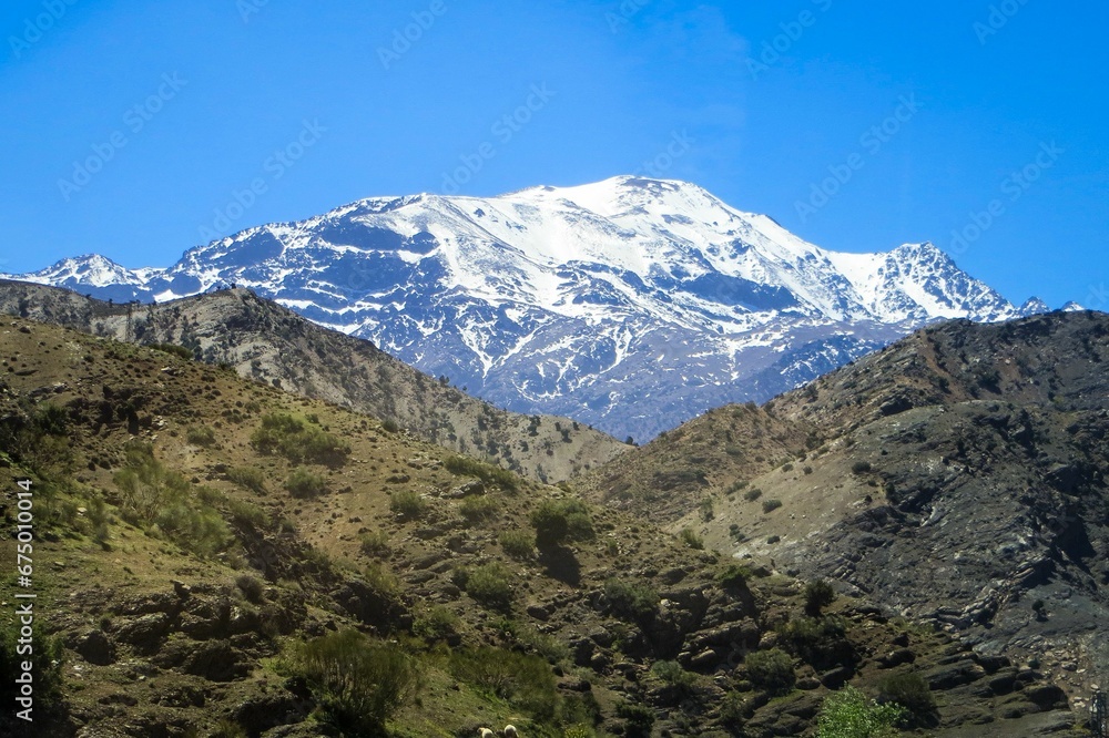 Stunning snow-capped mountain peak, against a crisp blue sky