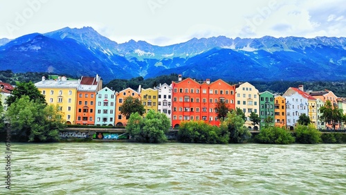 buildings line the bank of a river in innsbruck  austria