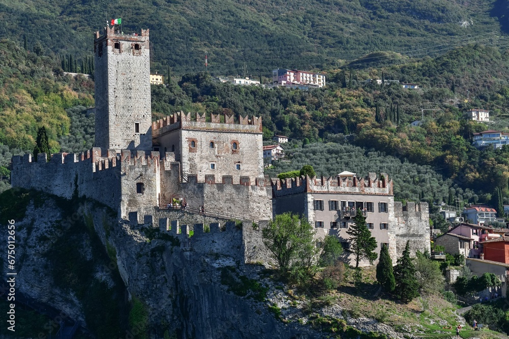 Stunning Malcesine Castle, surrounded by lush green hills and mountains in Italy