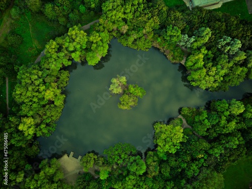 a view from above looking down at a lake surrounded by trees
