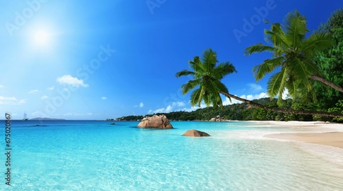 Scenic view of a tranquil, sandy beach and turquoise blue ocean waters photo