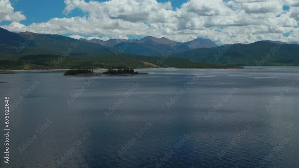 Aerial cinematic drone high altitude Grand Lake Shadow Mountain Grandby Colorado Rocky Mountain National park entrance calm clear beautiful summer morning boating two islands forward upward Aerial cinematic drone high altitude Grand Lake Shadow Mountain Grandby Colorado Rocky Mountain National park entrance calm clear beautiful summer morning boating two islands forward upward