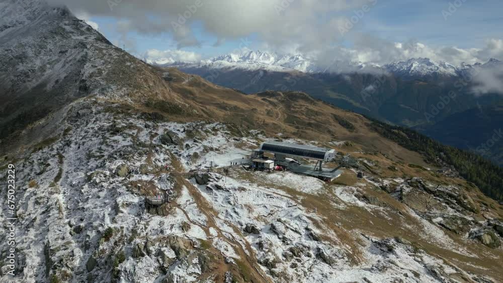 Gondola station at the top of the mountain in the Aletsch Arena region. The first snow has come. Little snow in the landscape Gondola station at the top of the mountain in the Aletsch Arena region. The first snow has come. Little snow in the landscape
