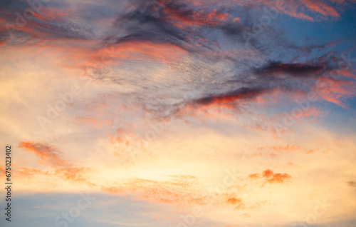 Cloudscape, Colored Clouds at Sunset near the Ocean on a Blue Sky