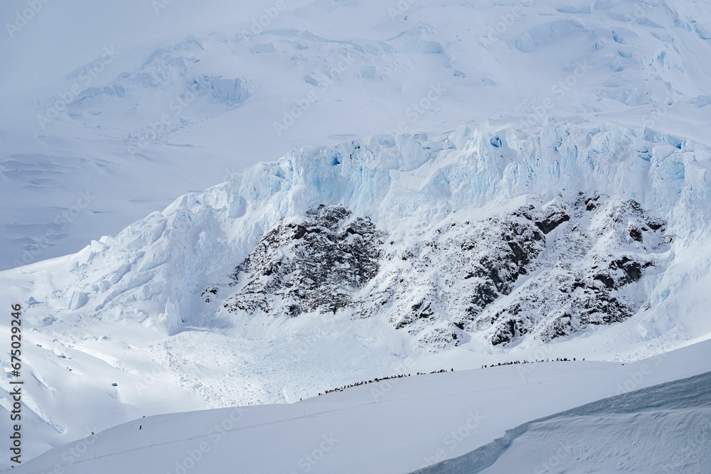 Scenic view of an iceberg in the sea on a cloudy day