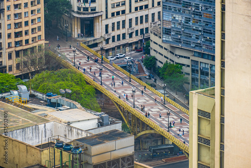 Aerial view of people crossing the Santa Ifigenia viaduct on downtown photo