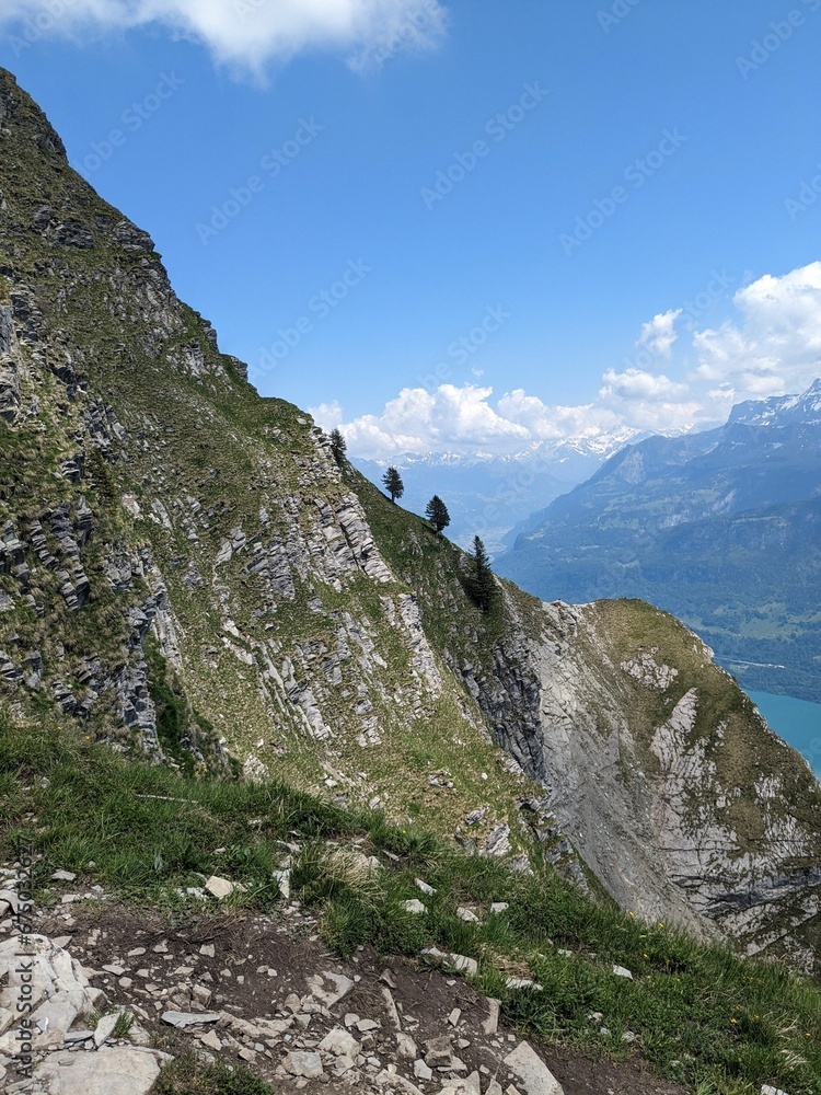 there is a view of the mountains and a lake on the far side there is a view of the mountains and a lake on the far side