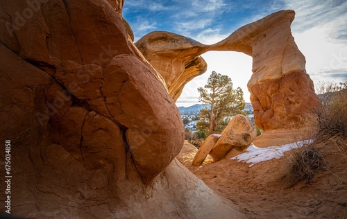 The desert landscape features two majestic natural sandstone arches  Devil s Garden