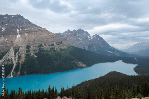 Majestic landscape depicts the Peyto lake surrounded by majestic mountains in Banff, Canada