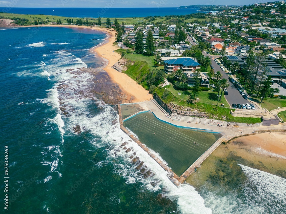 Aerial view of a tranquil sea and sandy beach in Collaroy, NSW, Australia