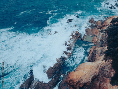 Aerial view of a stunning landscape featuring large rocks and sea, Bermagui Rock Pool, NSW