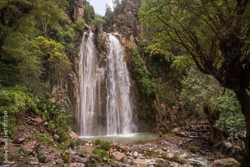 Idyllic waterfall cascades through a picturesque landscape in the countryside of Yemen