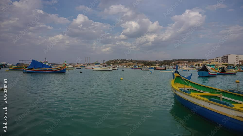 colorful fishing boats in harbour timelapse of Marsaxlokk port of Malta island colorful fishing boats in harbour timelapse of Marsaxlokk port of Malta island