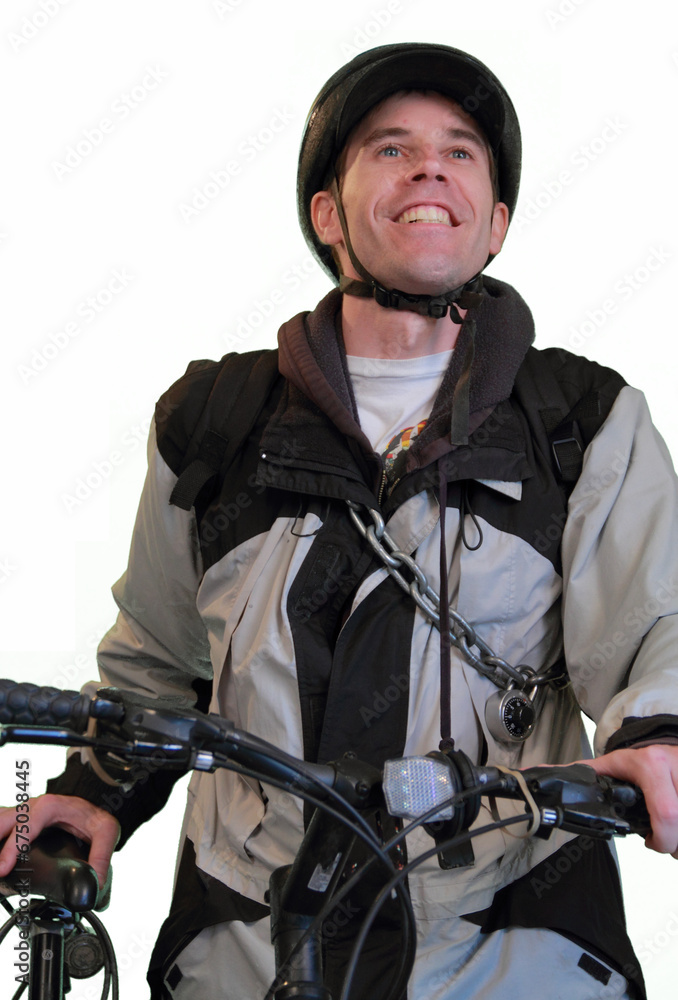 Vertical image of a hopeful bicyclist in his thirties ready to go on a bike ride. The man wears a biking helmet, jacket, and a bicycle chain with lock. His hands are on the bike. White backdrop. Vertical image of a hopeful bicyclist in his thirties ready to go on a bike ride. The man wears a biking helmet, jacket, and a bicycle chain with lock. His hands are on the bike. White backdrop.