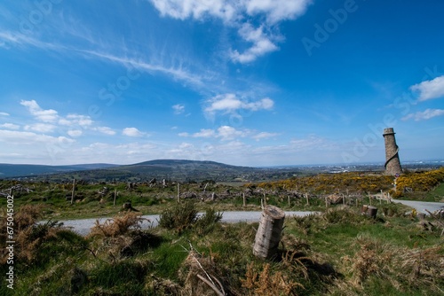 the Wicklow Mountains Landscape with a tower in the background © Wirestock