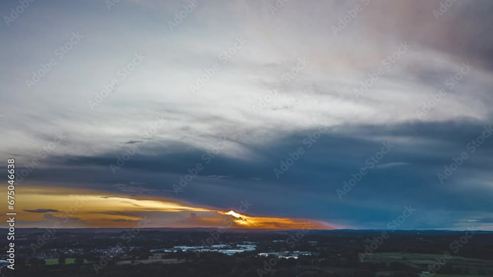Drone shot of sunset dark clouds over the city Drone shot of sunset dark clouds over the city