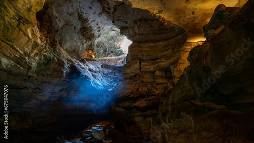 Image depicts a view of Carlsbad Caverns in New Mexico, shrouded in an ethereal mist