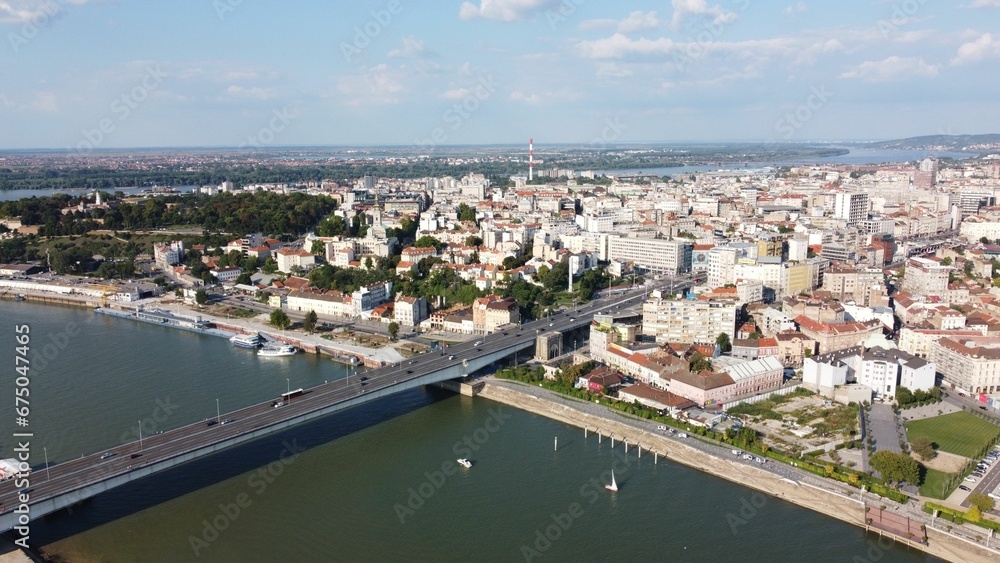 Aerial view of a cityscape with the Branko bridge over a river between buildings