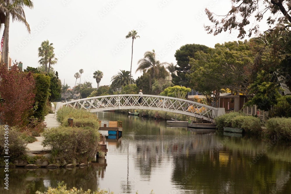 Idyllic scene of a bridge spanning a winding river in a quaint rural town