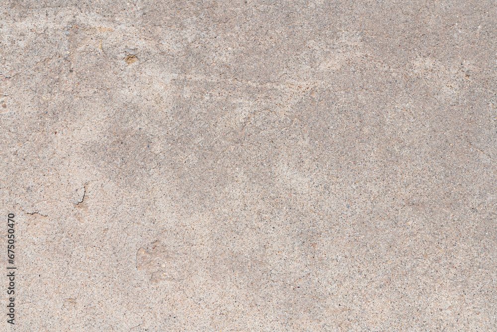 Detail of a section of weathered concrete sidewalk with a rough texture, gray colors, and thin cracks and chips in the surface. - obrazy, fototapety, plakaty 