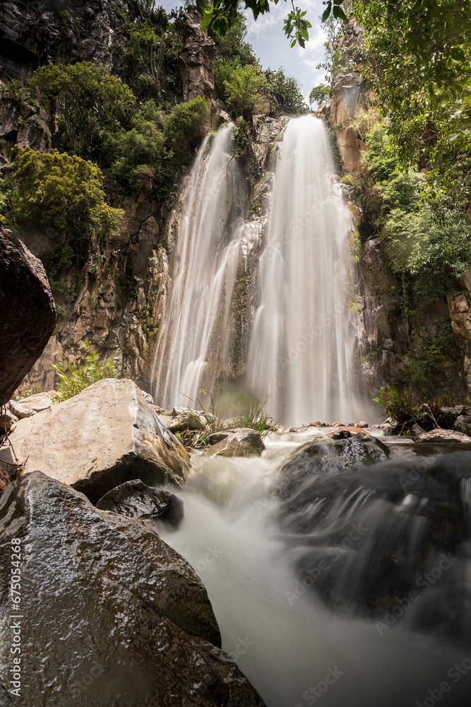 Fototapeta premium Natural view of the Wadi Banna waterfall in Al-Seddah, Yemen