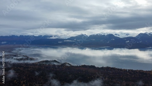 Breathtaking view of the Kachemak Bay in Homer, Alaska shrouded in a mysterious fog © Wirestock