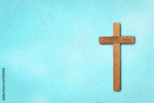 Classic wood carved a cross on the blue background © paul