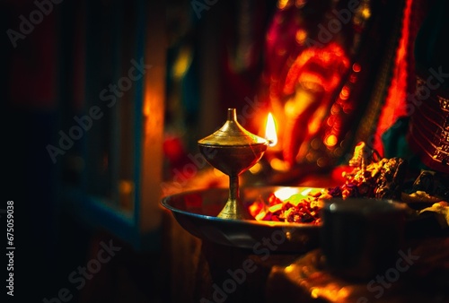 Oil Lamp on fire infront of Hindu god photo