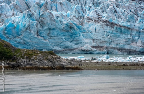 a couple of huge rocks in front of a glacier river, Glacier Bay National Park