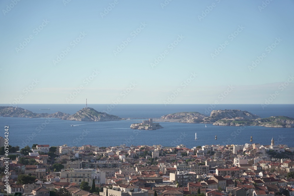 Blue sky over the sea and cityscape of Marseille captured from cathedral of Notre dame de lagarde