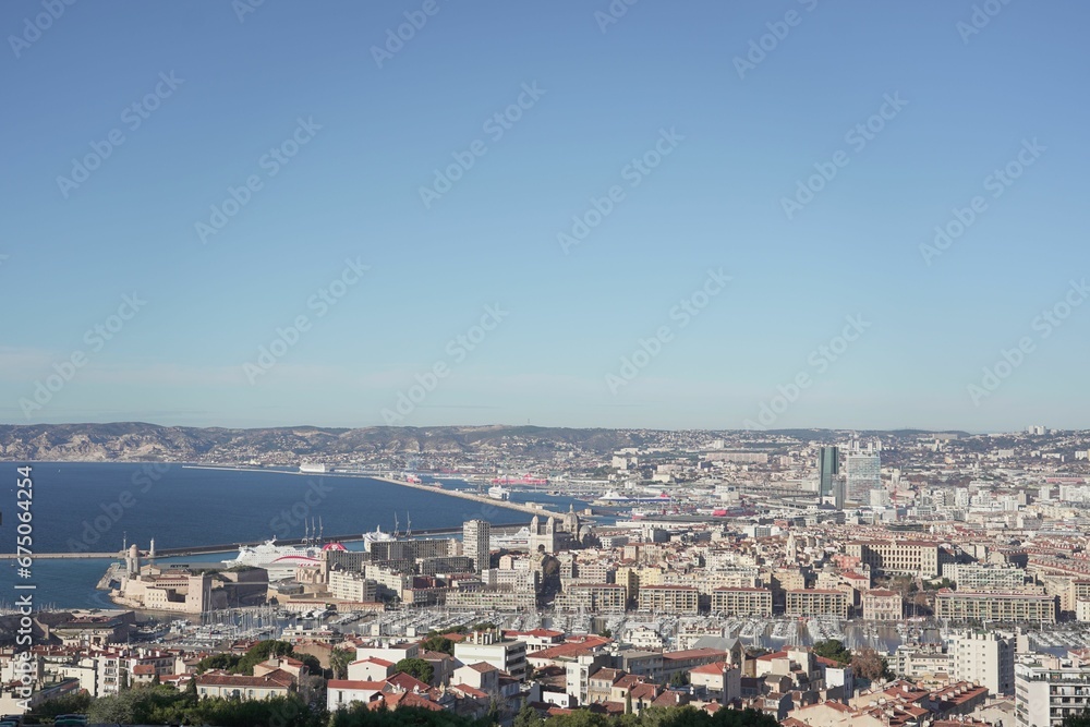 Blue sky over sea and cityscape of Marseille, France captured from Notre dame de lagarde cathedral