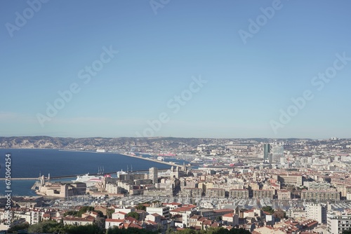 Blue sky over sea and cityscape of Marseille, France captured from Notre dame de lagarde cathedral