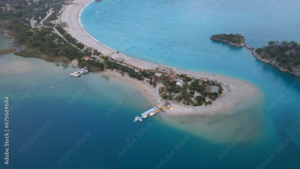 Naklejka premium Aerial view of the beach with moored boats. Oludeniz, Fethiye, Turkey.