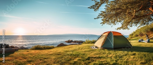 Camping on the beach at sunset. view of a camping tent on a summer evening.