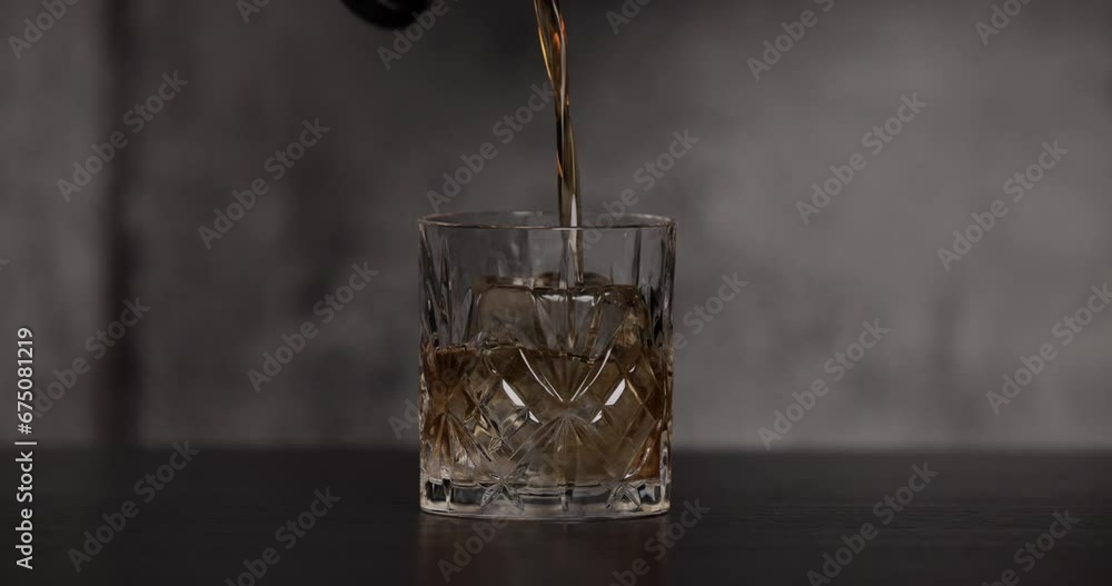 Negroni with gin, sweet vermouth and Carmpari garnished with orange peel, in a cinematic moody setting. Negroni with gin, sweet vermouth and Carmpari garnished with orange peel, in a cinematic moody setting.