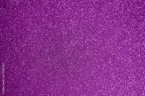 Fondo de brillos / textura glitter de color fucsia / rosa/morado. Se puede usar como fondo de celebración o decoración fiesta.