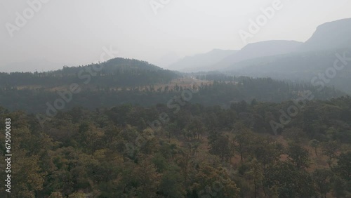 Beautiful Aerial view of the mountains rages in the western ghats of India know as Sahyadri Mountain range. Drone shot of Layers of mountain in morning time. photo