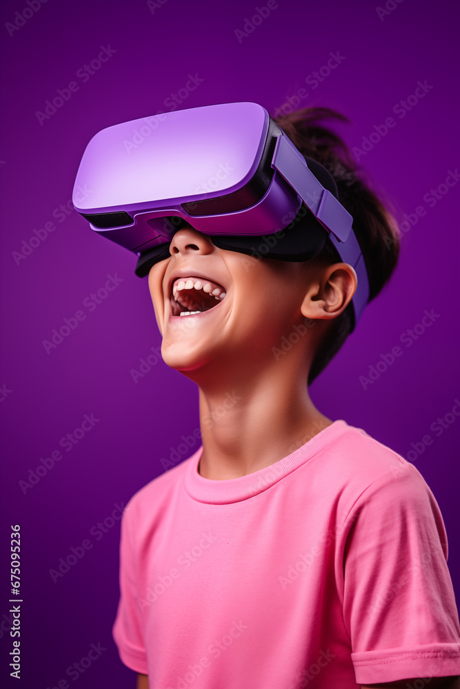Young boy getting experience using VR headset glasses isolated on a purple background Young boy getting experience using VR headset glasses isolated on a purple background
