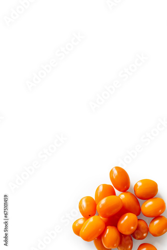 Closeup of fresh juicy organic orange cherry tomatoes from the garden isolated on a white background from above, top view