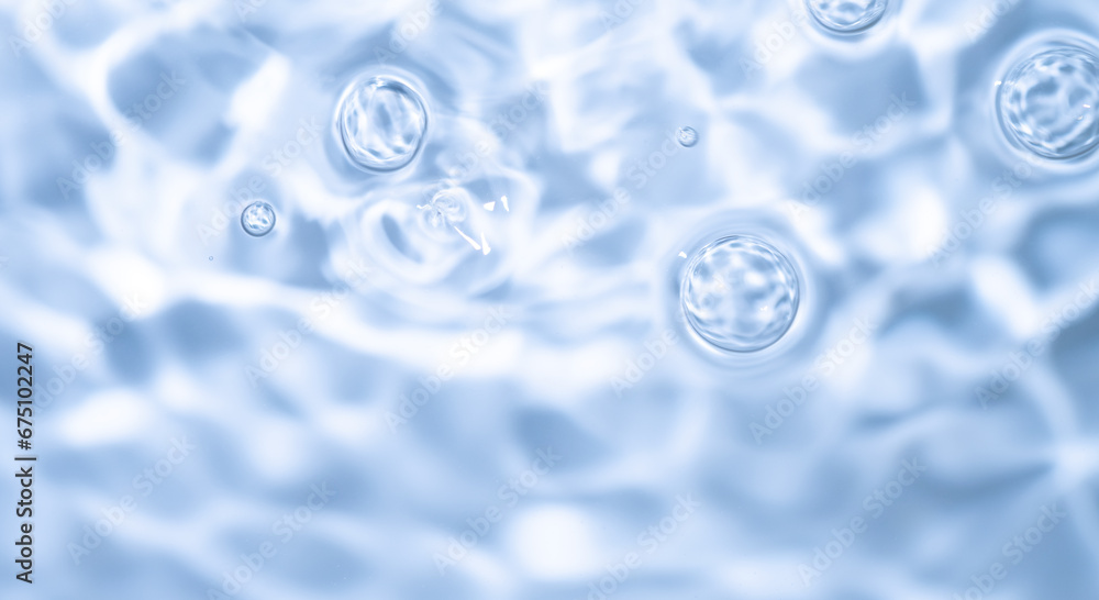 Natural background of water in summer. Blue surface. Clear water with ripples and splashes. water waves in sunlight The water surface has waves. Natural background of water in summer. Blue surface. Clear water with ripples and splashes. water waves in sunlight The water surface has waves.