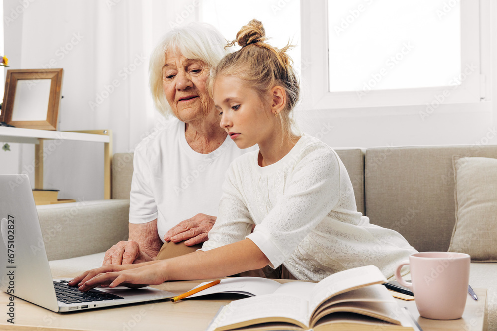 Laptop granddaughter family bonding selfie child hugging sofa grandmother smiling togetherness Laptop granddaughter family bonding selfie child hugging sofa grandmother smiling togetherness