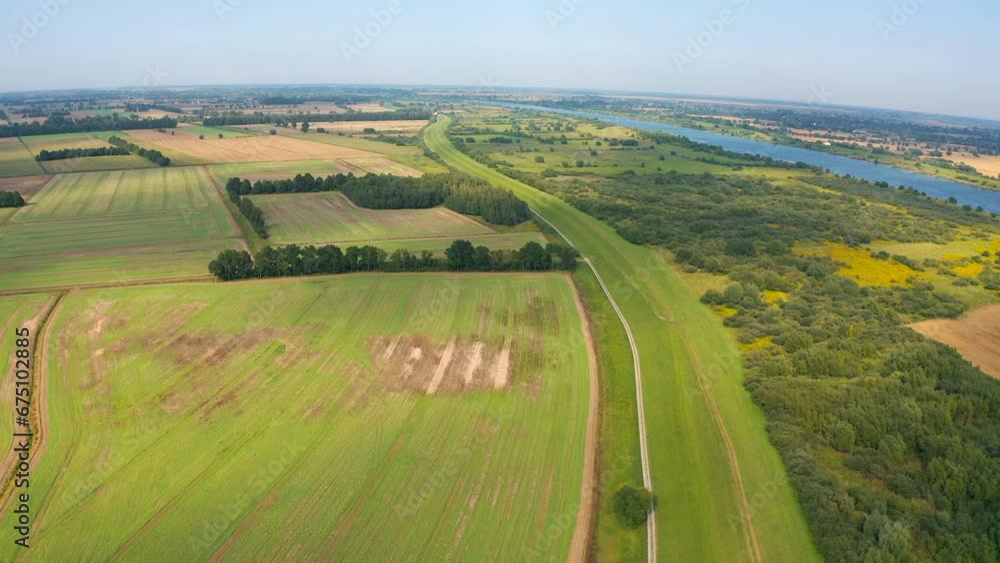 Aerial top view of drone flying above farmland river in the background Aerial top view of drone flying above farmland river in the background