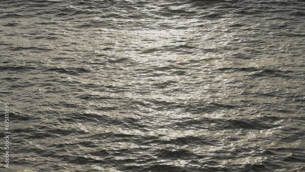 Soft sea waves with sun reflections during the evening. Soft sea waves with sun reflections during the evening.