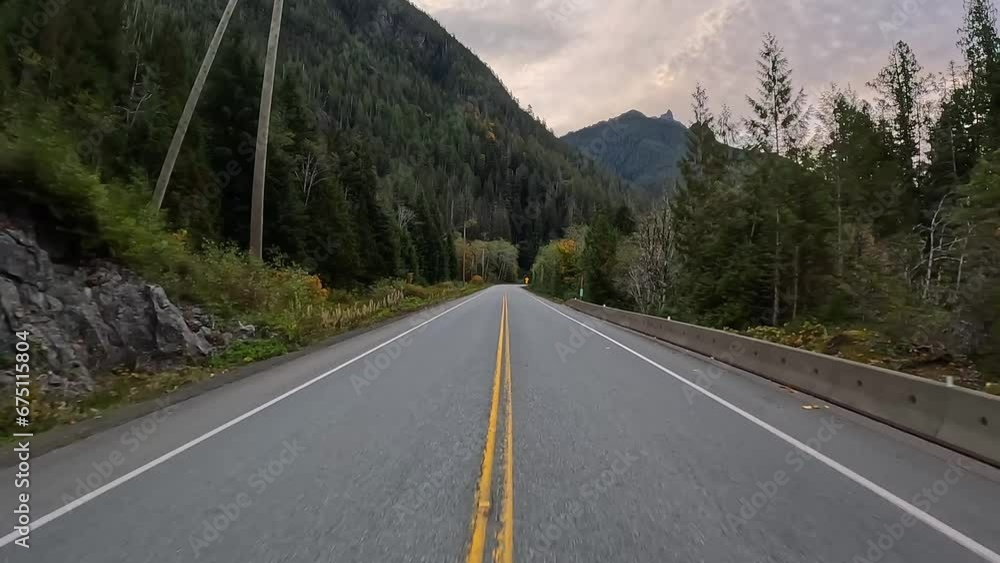 Scenic Road surrounded by Trees and Mountains. Vancouver Island, BC Canada. Fall Season. High quality 4k footage. Sunrise Scenic Road surrounded by Trees and Mountains. Vancouver Island, BC Canada. Fall Season. High quality 4k footage. Sunrise