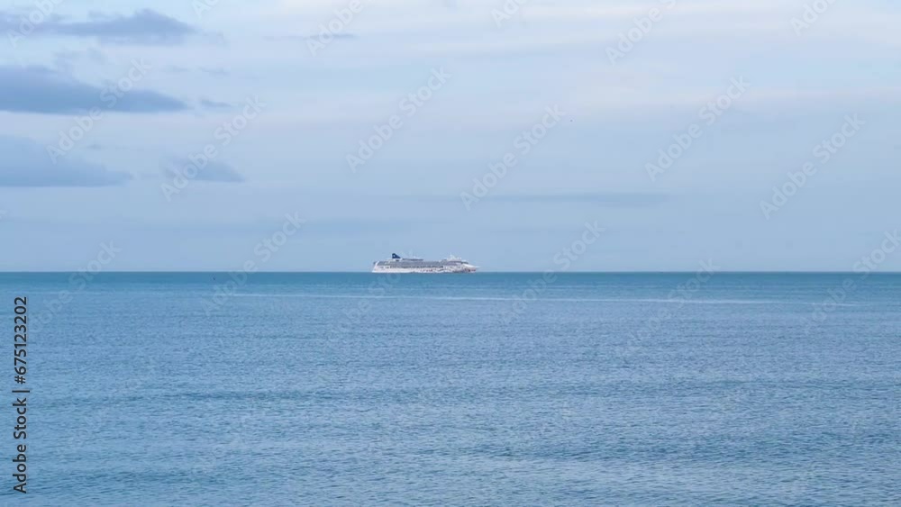 White Cruise Ship Sailing in the Majestic Evening Ocean White Cruise Ship Sailing in the Majestic Evening Ocean