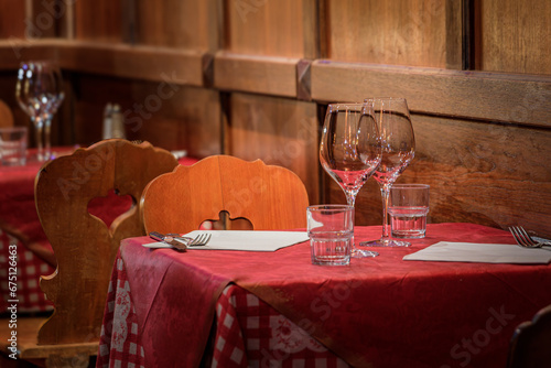 Canvas Print Tables with a checkered tablecloth at an Alsatian winstub restaurant in a tradit