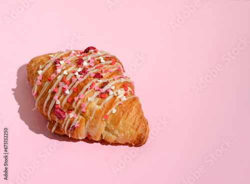 croissant with hearts on a pink background